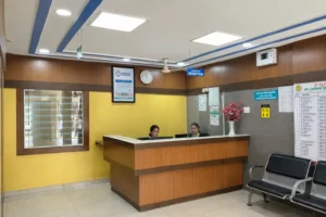 Modern hospital reception area with signage Modern hospital reception area
